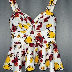 Strappy floral peplum top. Never worn.